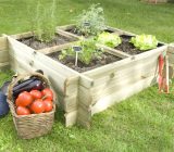 What material should I use to create a square vegetable garden?